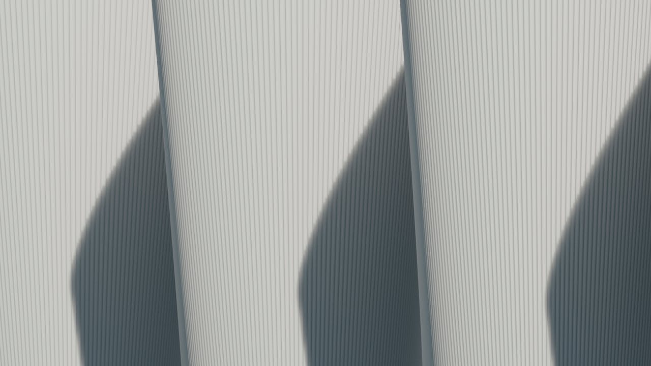 Abstract architectural image showcasing minimalist lines and strong shadows.